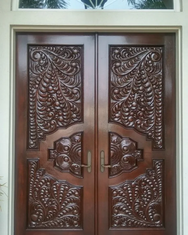 Carved mahogany entry door refinished by SRQ Door Refinishing