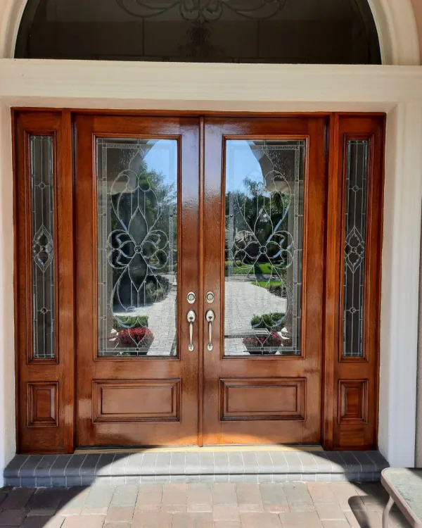 Dark mahogany residential entry door refinished in University Park