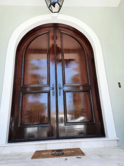 Dark mahogany door finished in marine-grade varnish