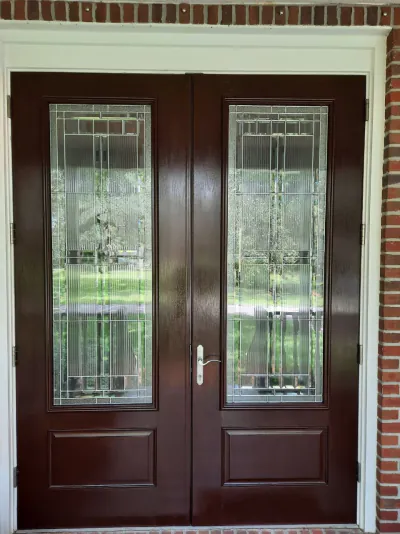 Rich mahogany entry door after refinishing