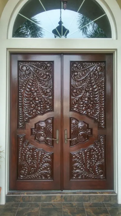 Carved mahogany entry door after refinishing