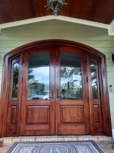 Dark mahogany front entry door after refinishing